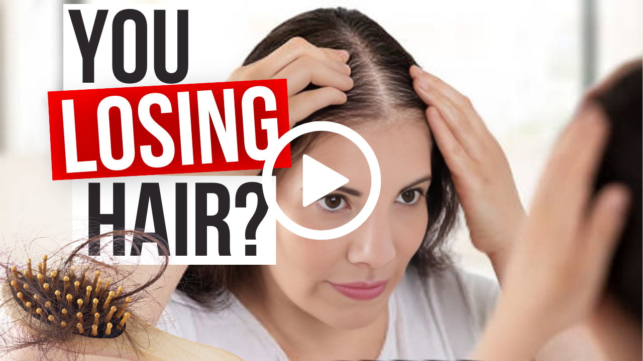 A woman examines her hair in a mirror, noticing visible hair loss. A hairbrush with loose strands lies nearby. Text reads, "Can You Regrow Hair After Menopause? Find Out